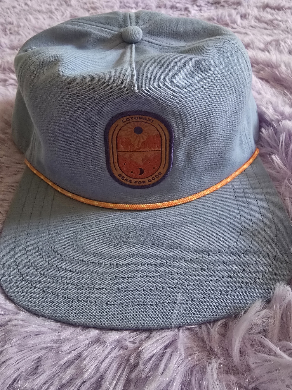 cotopaxi light blue 5-panel cap with orange trim
